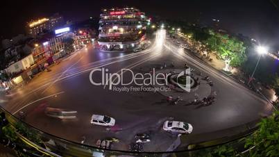 Timelapse of traffic on city square in night Hanoi, Vietnam