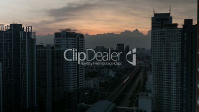 Time lapse shot of cityscape with skyscrapers, buildings and industrial smog under city on the background. Bangkok, Thailand