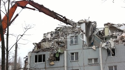 Demolition of building in urban environments with heavy machinery