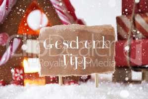 Gingerbread House With Sled, Snowflakes, Geschenk Tipp Means Gift Tip