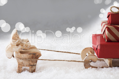 Reindeer With Sled, Silver Bokeh Background, Copy Space