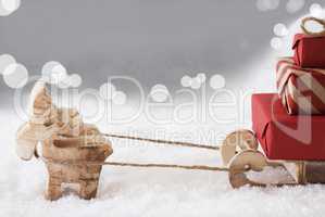 Reindeer With Sled, Silver Bokeh Background, Copy Space
