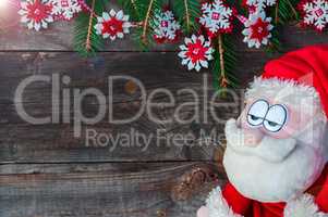 Sad Santa on a background of a wooden wall