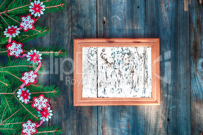 empty wooden frame for Christmas lettering decorated with fir br
