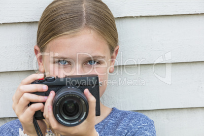 Girl Child Taking Picture With A Camera