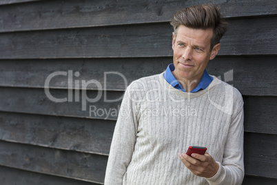 Happy Middle Aged Man Using Mobile Cell Phone