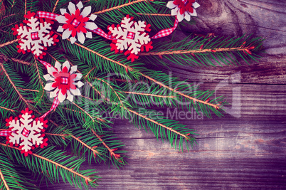 Christmas wooden background with decorations and spruce branche