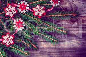 Christmas wooden background with decorations and spruce branche