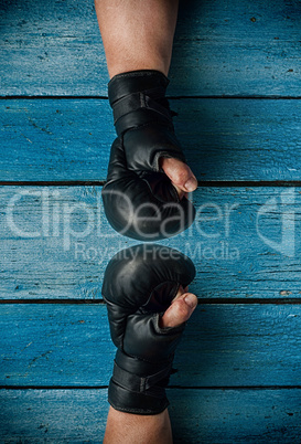 Two hands in boxing gloves, vintage toning