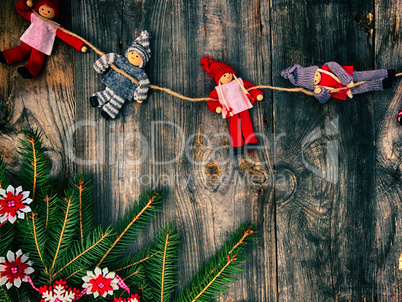 Textile Christmas toys on gray old wooden background