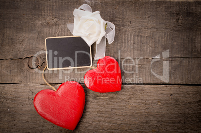 Two red wooden heart shapes