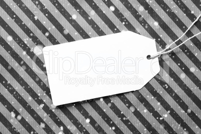 Label On Black Wrapping Paper And Copy Space, Snowflakes