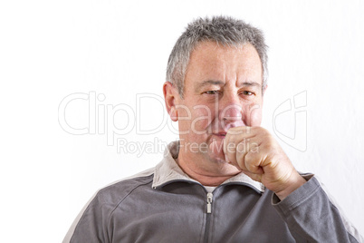 Man with hand in front of mouth