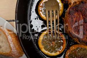 pork chop seared on iron skillet