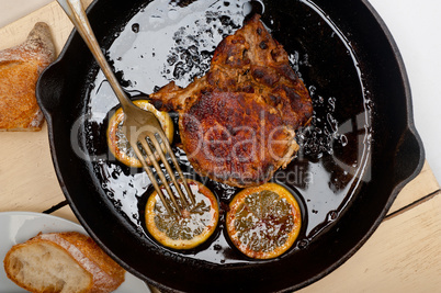 pork chop seared on iron skillet