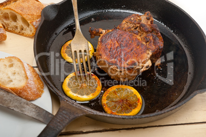 pork chop seared on iron skillet