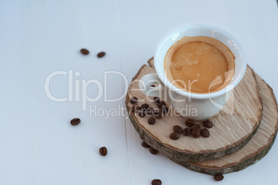 cup of coffee on wooden circles, selective focus