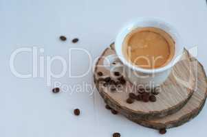 cup of coffee on wooden circles, selective focus