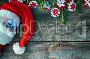 Santa claus sad face and fir branches decorated