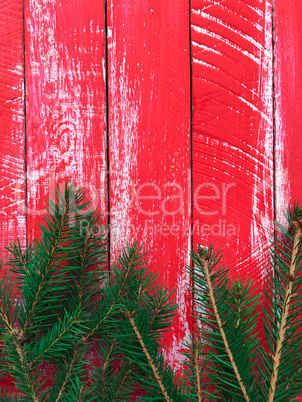 Red wood background with branch fir