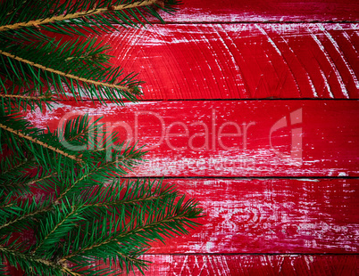 Vintage red wood background with branch fir