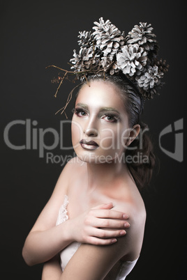 Elegant Girl in the New Year Wreath of Pine Cones