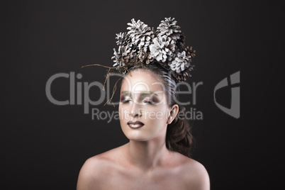 Elegant Girl in the New Year Wreath of Pine Cones