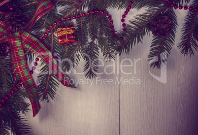 Vintage Christmas background with decorated branches of spruce