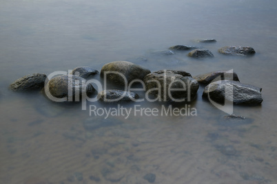 Stones in Surf Long Exposure Photo