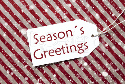 Label On Red Paper, Snowflakes, Text Seasons Greetings