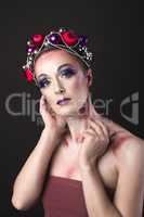 Elegant Model with Bright New Year's Eve Make-up in a Wreath of