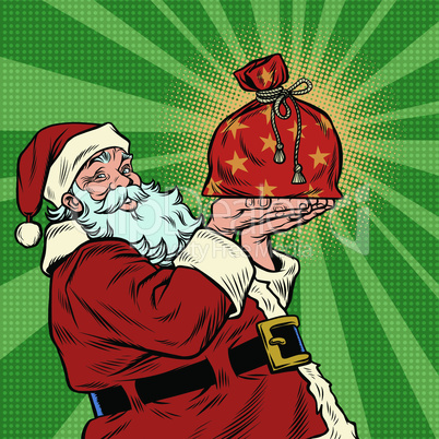 Santa Claus with a festive Christmas gift bag