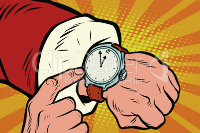 Santa Claus shows the clock, nearly midnight