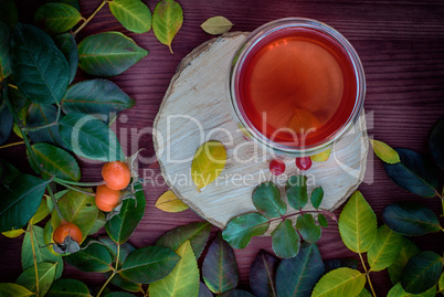 Tea with fruits on a wooden surface, vintage toning