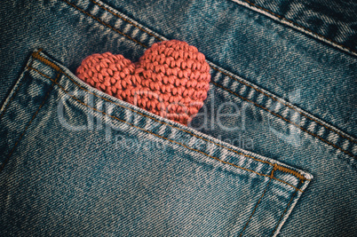 Small knitted heart in the back pocket of jeans