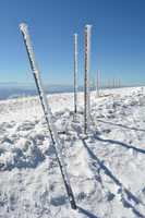 Row of frozen pilars, vertical orientation