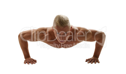 Naked bodybuilder posing while doing push-ups
