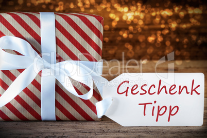 Atmospheric Christmas Present With Label, Geschenk Tipp Means Gift Tip