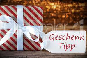 Atmospheric Christmas Present With Label, Geschenk Tipp Means Gift Tip