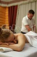 In spa center. Portrait of girl getting massage