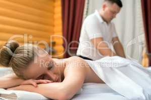 Photo of relaxed girl during she getting massage