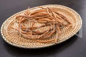 Basketry. Image of willow twigs on wicker tray