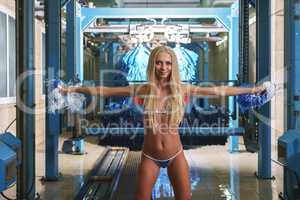 Sexy blonde entices customers to car wash