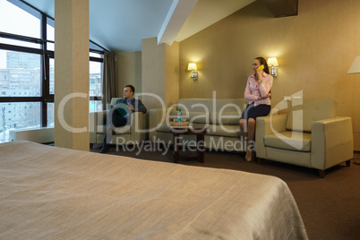 Business people wait for conference in hotel room