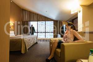 Business partners wait for meeting in hotel room