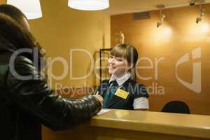 Hotel manager welcoming smiles the guest