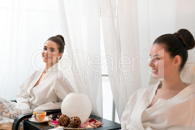 Smiling client of beauty salon posing at camera