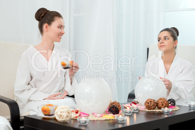 Image of lovely girls drinking tea in beauty salon