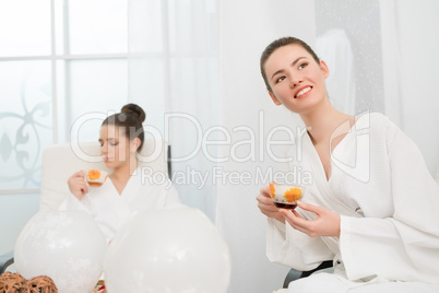 Image of pretty young girls relaxing in spa salon