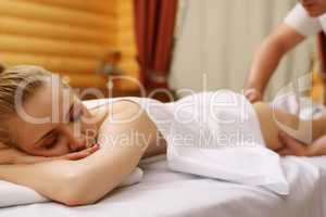 Spa. Portrait of relaxed woman during massage